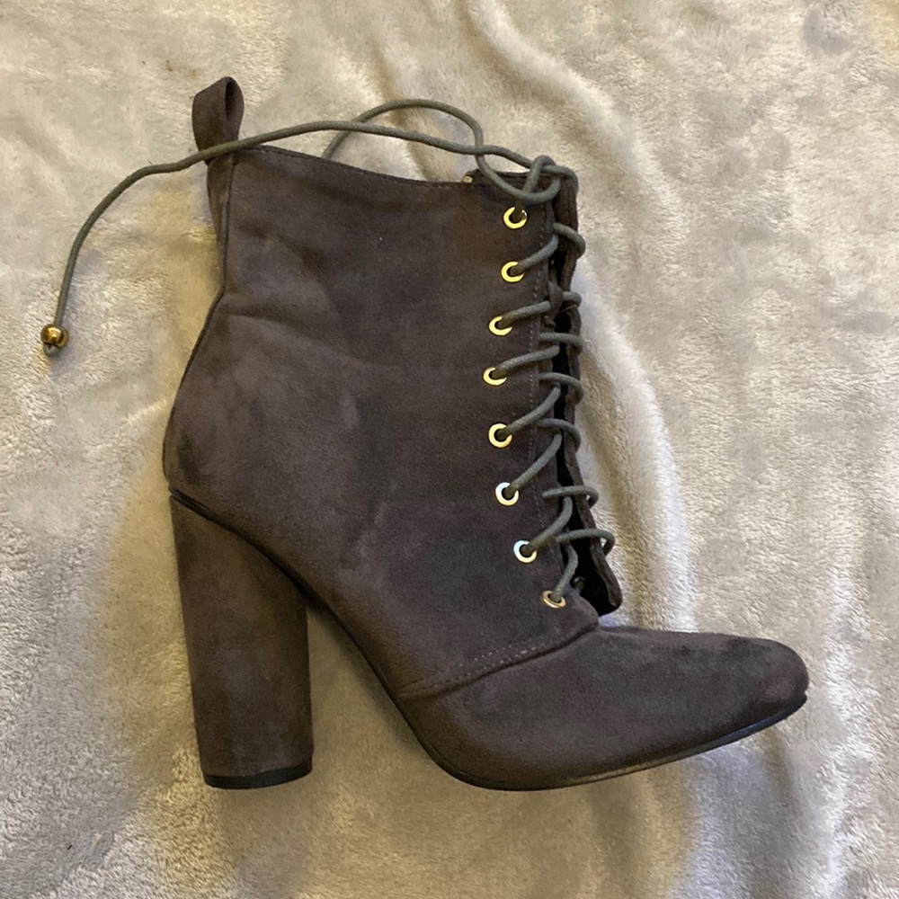 Heeled zip up boots.